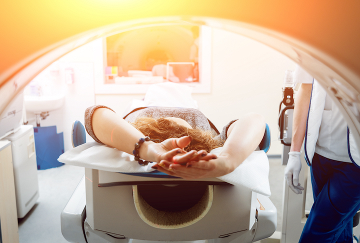 Medical equipment. Doctor and patient in the room of computed tomography at hospital.