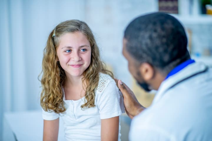 Image of doctor visit with girl