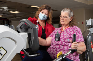 Pulmonary Rehab patient working with therapist.