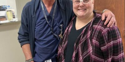 Dr. Chip Scott, West Tennessee Healthcare neurosurgeon, standing with patient Amanda Puckett.