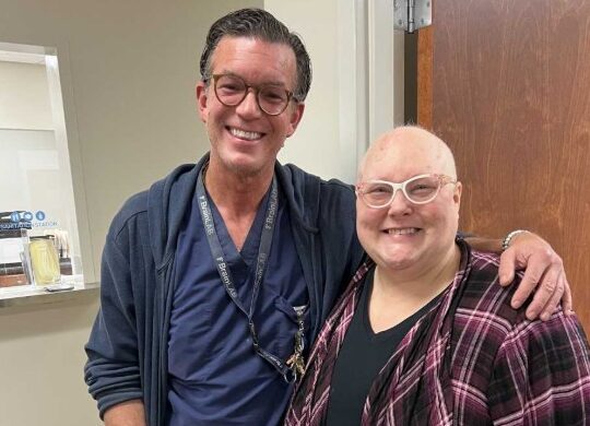 Dr. Chip Scott, West Tennessee Healthcare neurosurgeon, standing with patient Amanda Puckett.